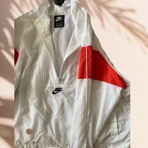 orange and white Nike wind breaker